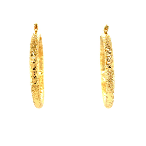 The Beautiful Texturized Hoops Earrings, crafted from 14k gold-filled material and measuring 4cm in diameter, are elegantly displayed against a pristine white background. These exquisite hoop earrings are lead and nickel free, offering both style and comfort for all-day wear.